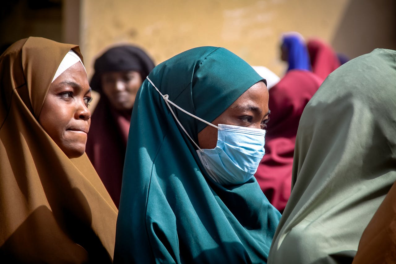 diverse-group-of-women-wearing-hijabs-and-face-masks-32966851